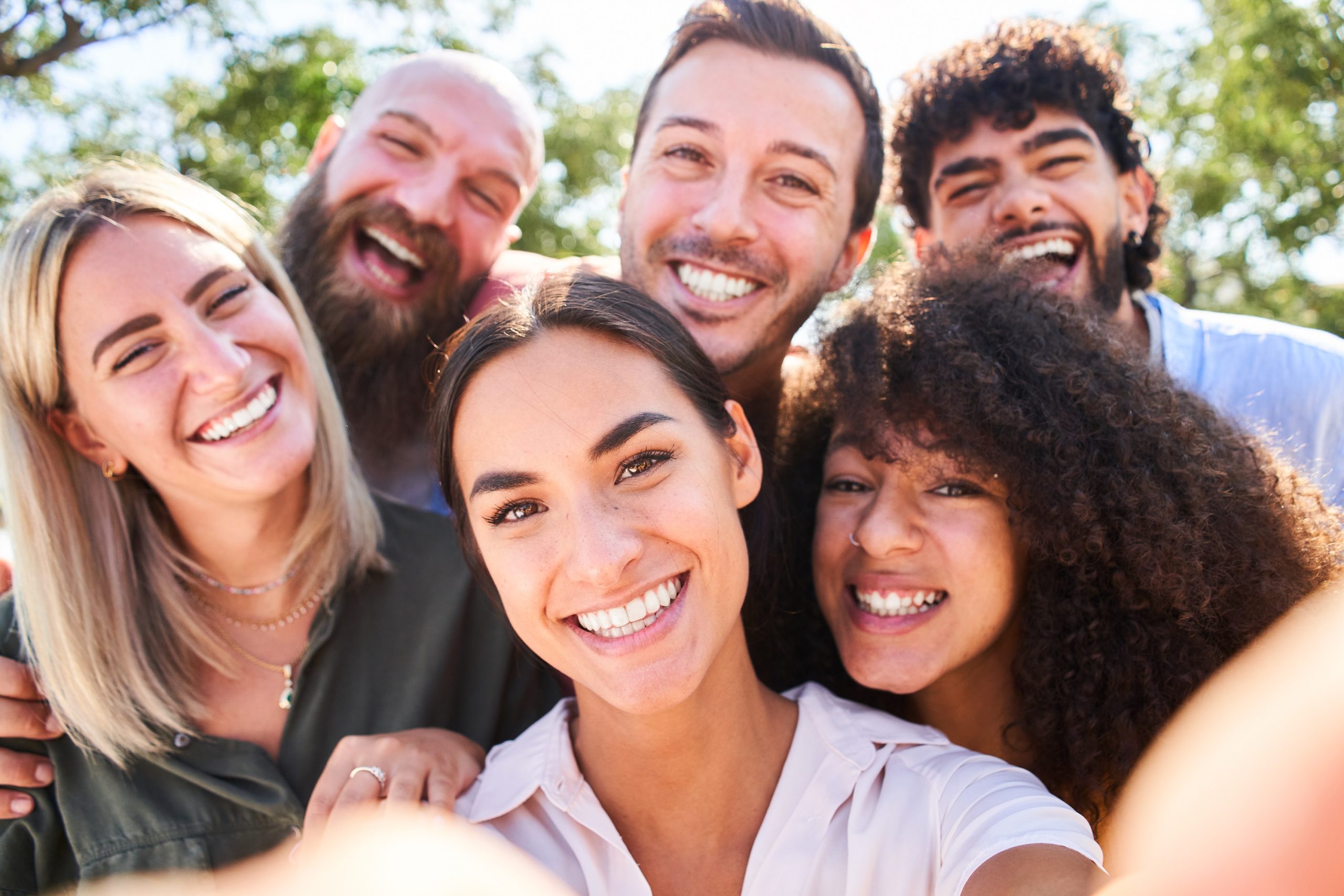 Multiracial people taking selfie outdoors - Happy life style concept with young smiling friends having fun together.